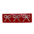 Fladt, rødt hårspænde med tre sløjfer i klare similisten