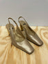 Slingback-stiletter fra Stuart Weitzman i guld